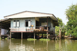 Lake house experiencing front yard flooding