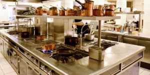 Clean commercial kitchen with chef