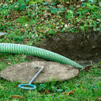 septic system cleaning in a residential backyard